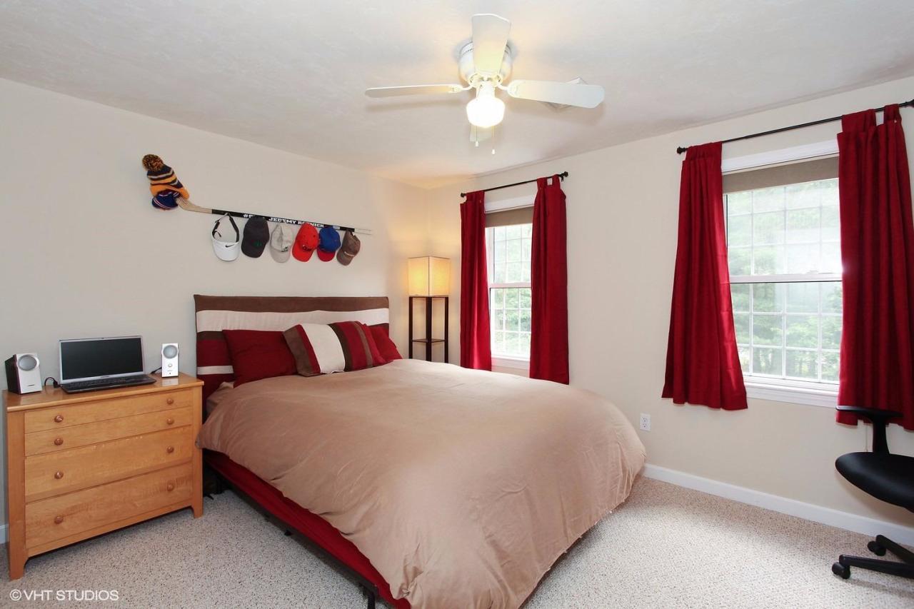 272 Cotuit Road Mashpee, MA 02649 - Photo 12 of 15 a bedroom with a bed and a window