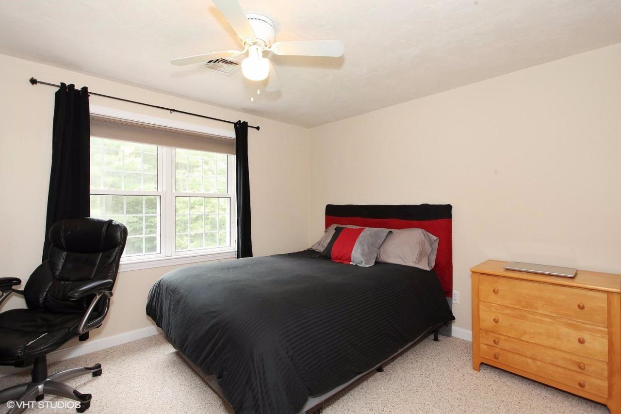 272 Cotuit Road Mashpee, MA 02649 - Photo 13 of 15 a bedroom with a bed and a window