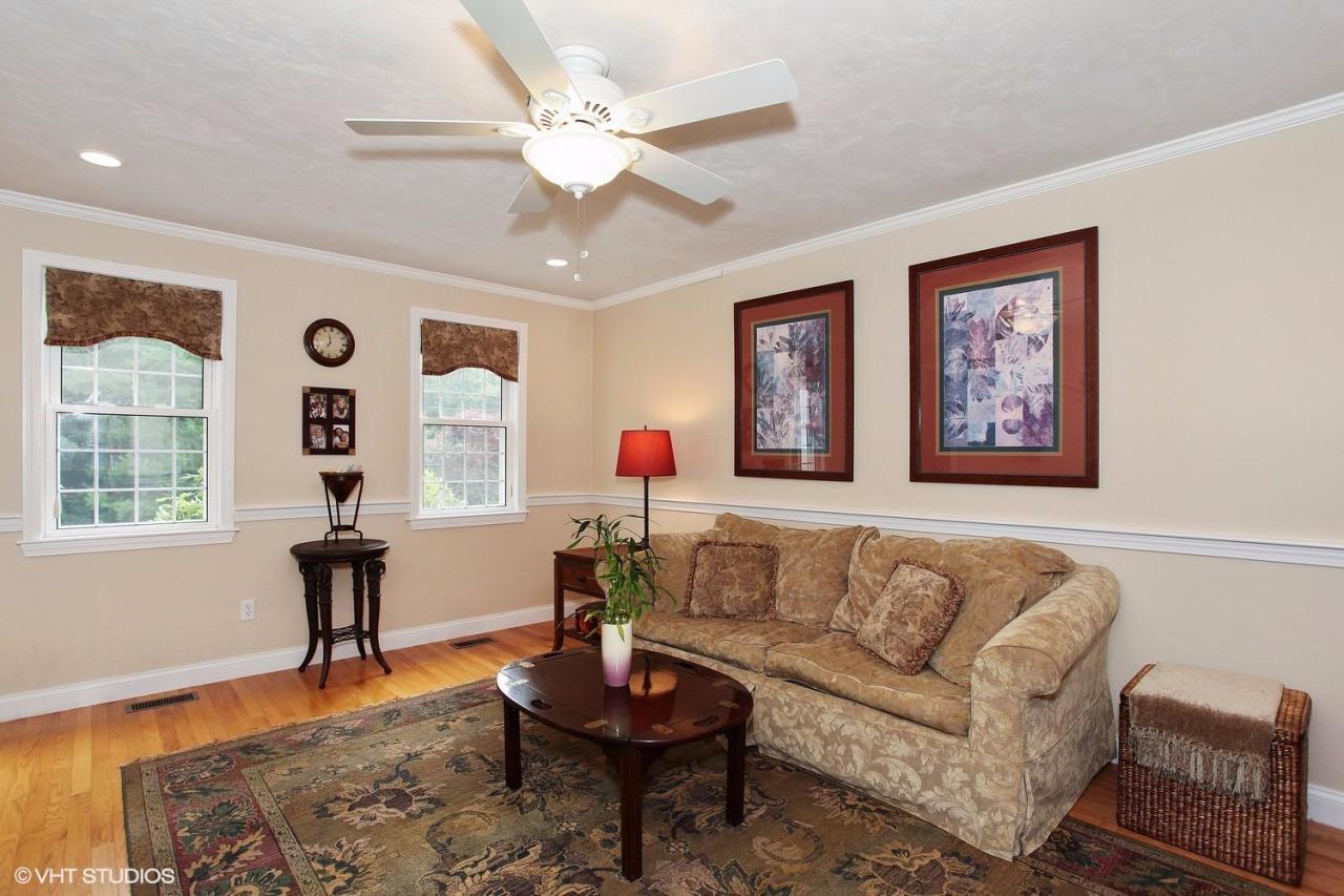 272 Cotuit Road Mashpee, MA 02649 - Photo 8 of 15 a living room with furniture and wooden floor