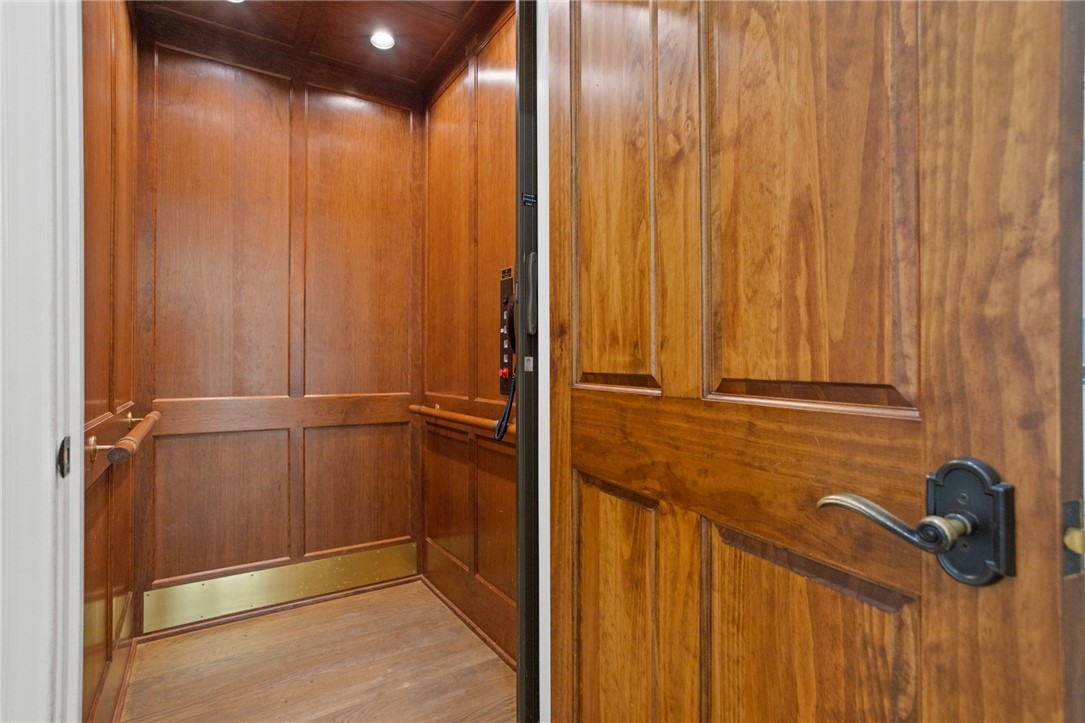 314 Palmer Way Sunset, SC 29685 - Photo 13 of 48 Step into the elegant wood-paneled elevator, offering convenient access to every level of the home.