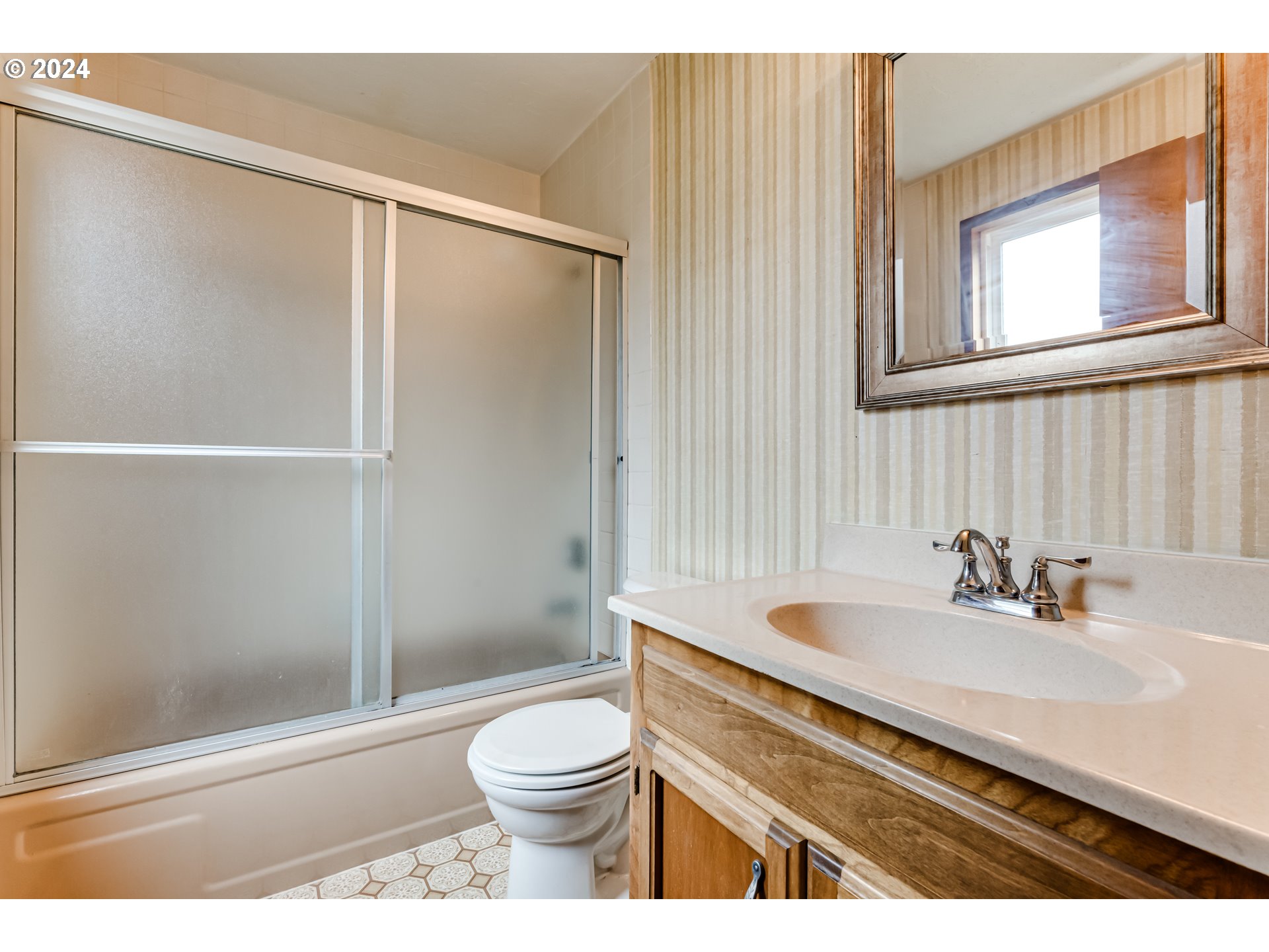 1038 5th Street Springfield, OR 97477 - Photo 16 of 26 a bathroom with a sink a toilet and shower