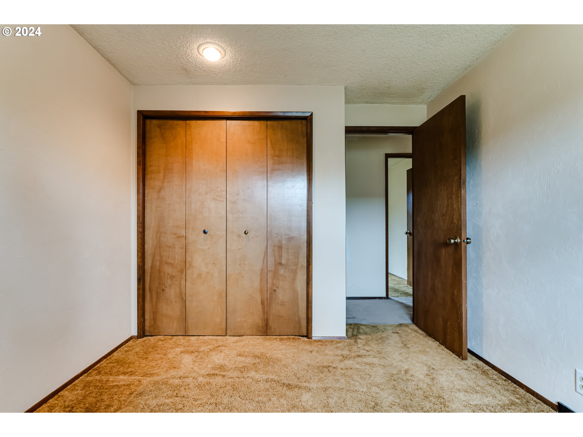 1038 5th Street Springfield, OR 97477 - Photo 18 of 26 a view of an empty room with closet and a bathroom