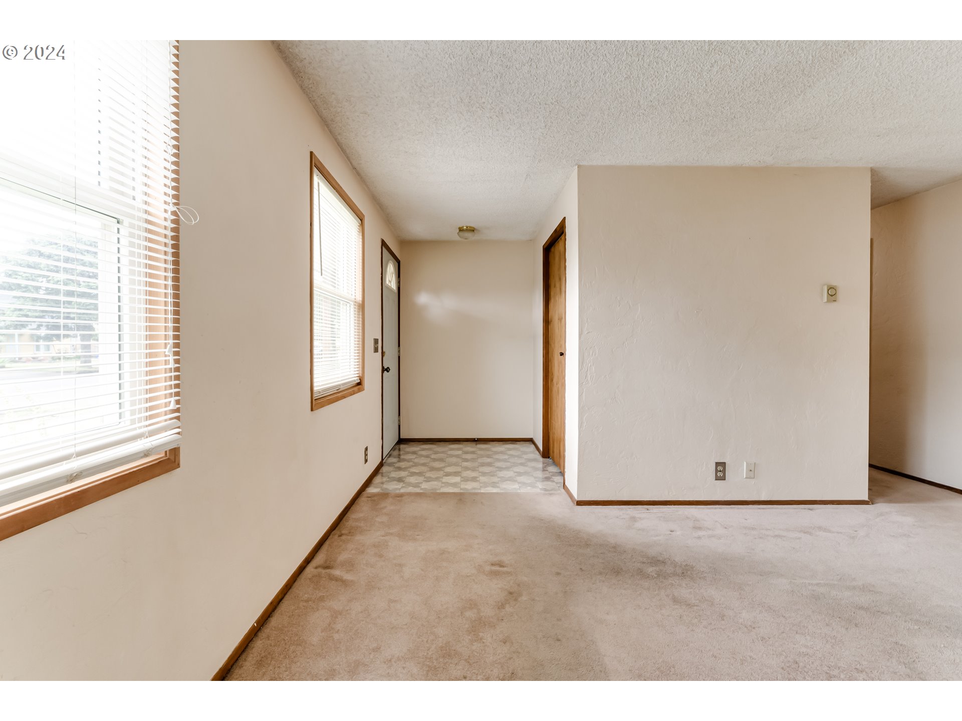 1038 5th Street Springfield, OR 97477 - Photo 5 of 26 a view of an empty room with a window