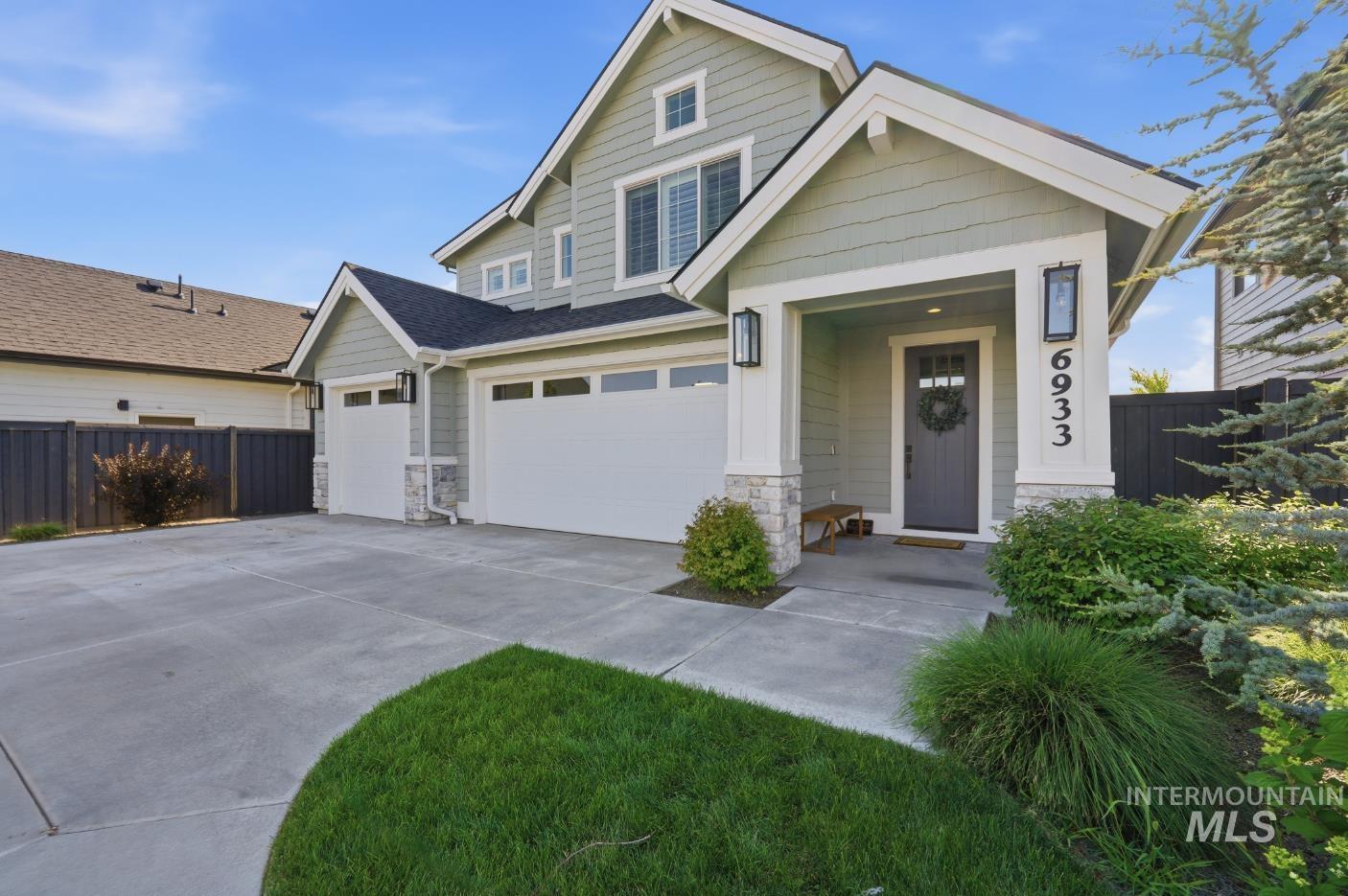 6933 South Zenith Avenue Meridian, ID 83642 - Photo 1 of 34 Contemporary two-story exterior featuring light green siding and white trim