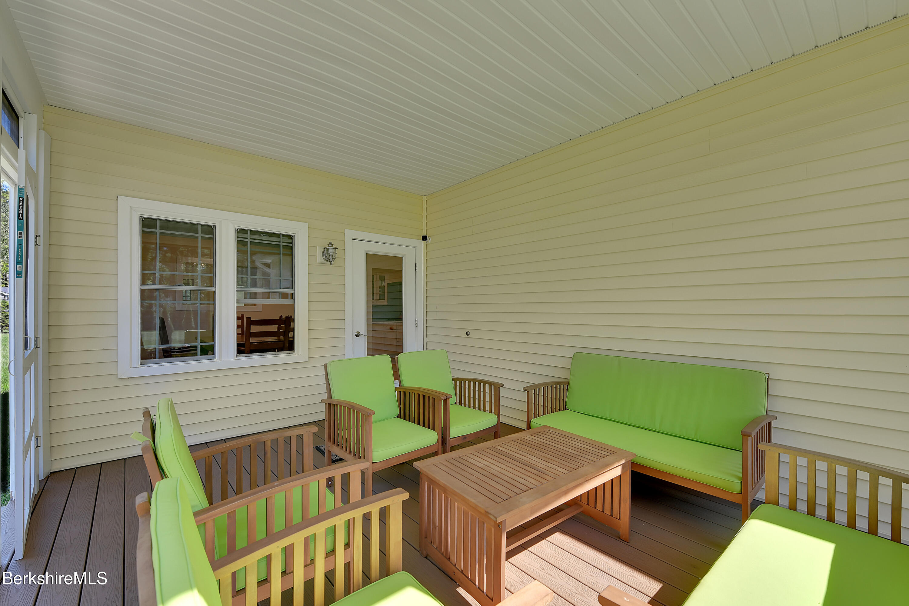 583 W Road Lee, MA 01238 - Photo 11 of 37 a wooden bench sitting in front of a house