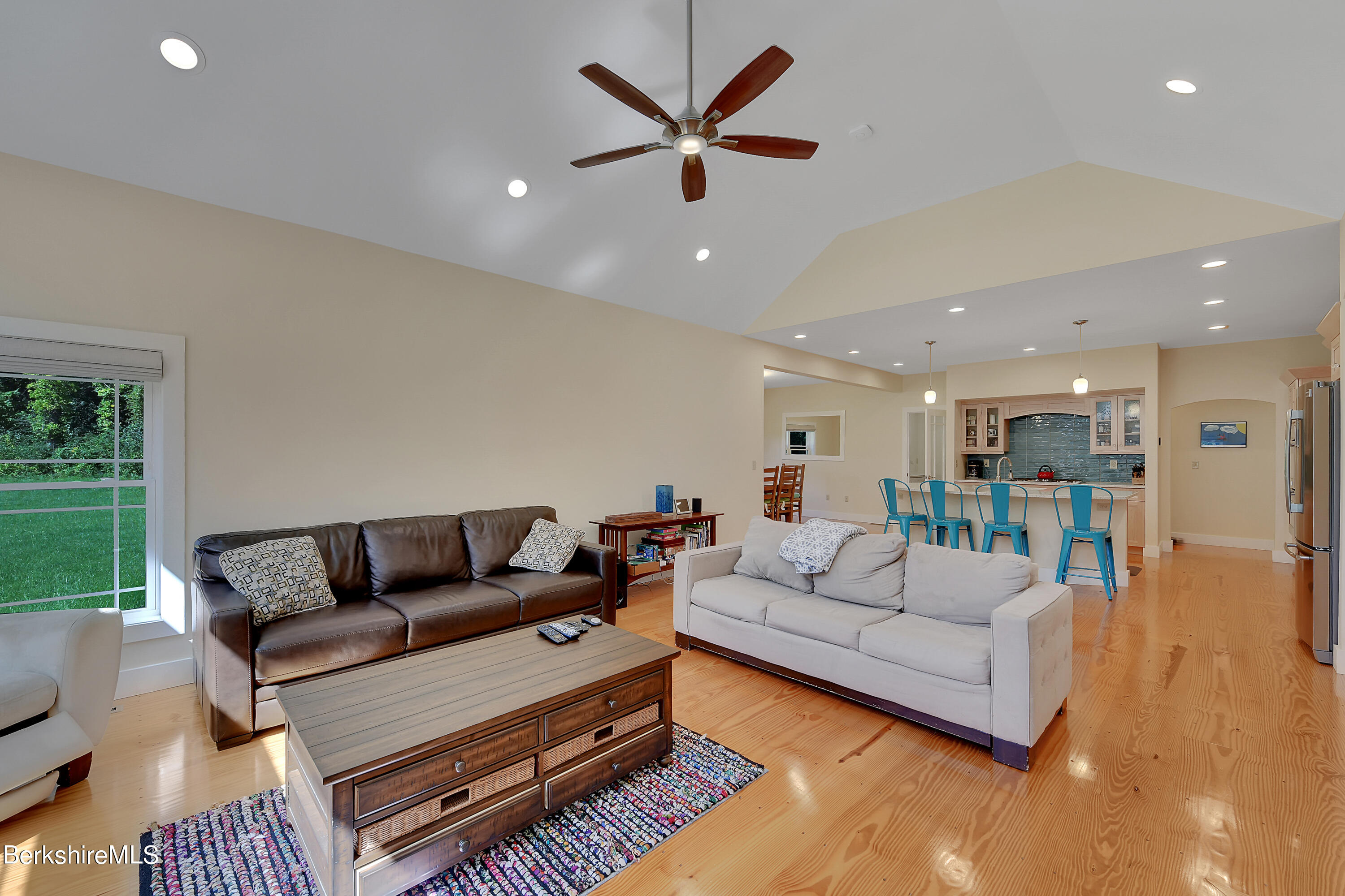 583 W Road Lee, MA 01238 - Photo 12 of 37 a living room with furniture ceiling fan and a rug