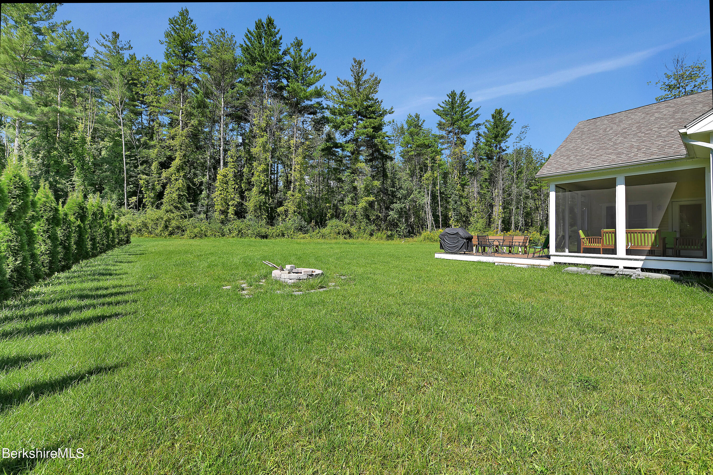 583 W Road Lee, MA 01238 - Photo 17 of 37 a view of a house with a backyard