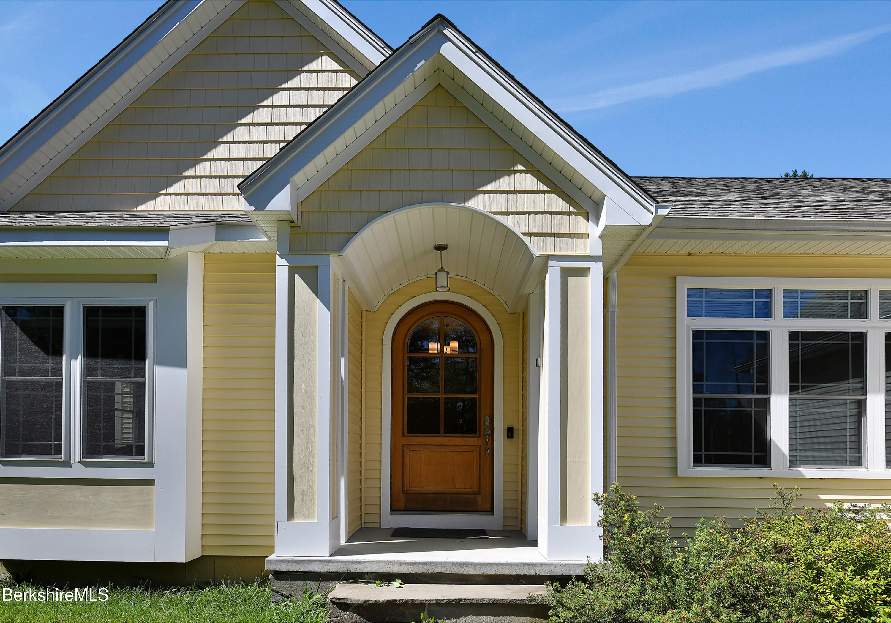 583 W Road Lee, MA 01238 - Photo 2 of 37 a front view of a house with glass windows