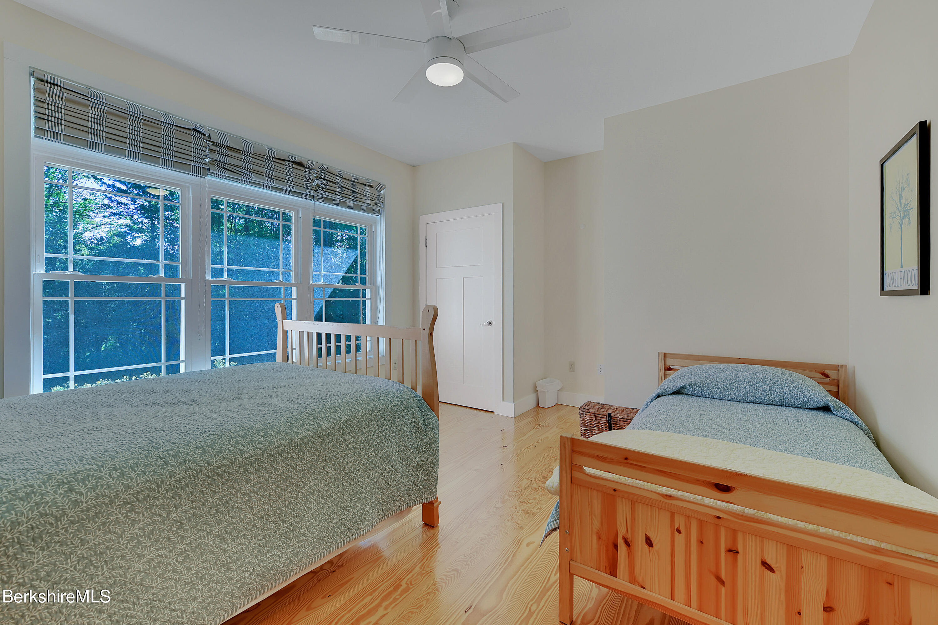583 W Road Lee, MA 01238 - Photo 22 of 37 a bedroom with a bed and a large window
