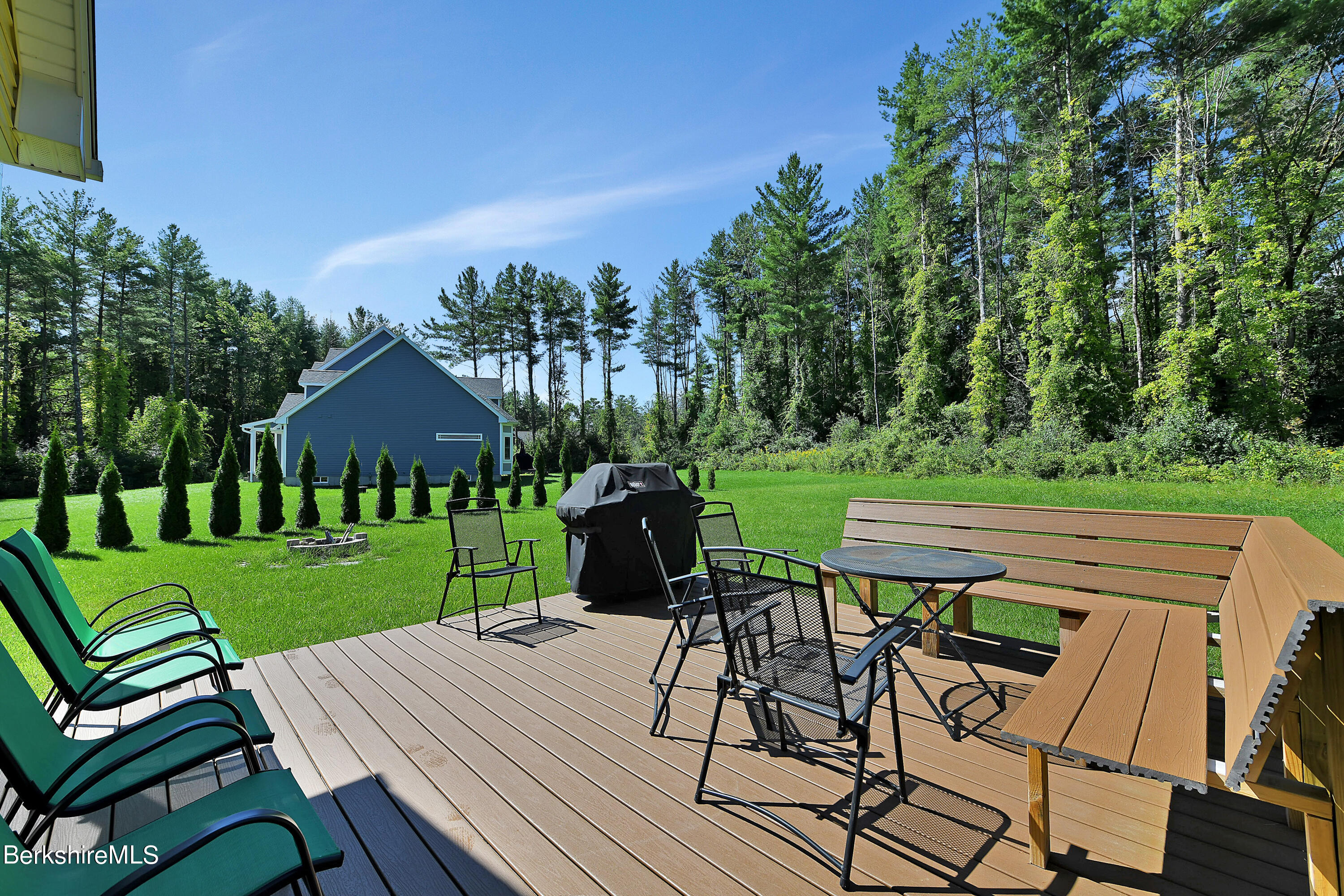 583 W Road Lee, MA 01238 - Photo 23 of 37 a view of a chairs and table in patio with a yard