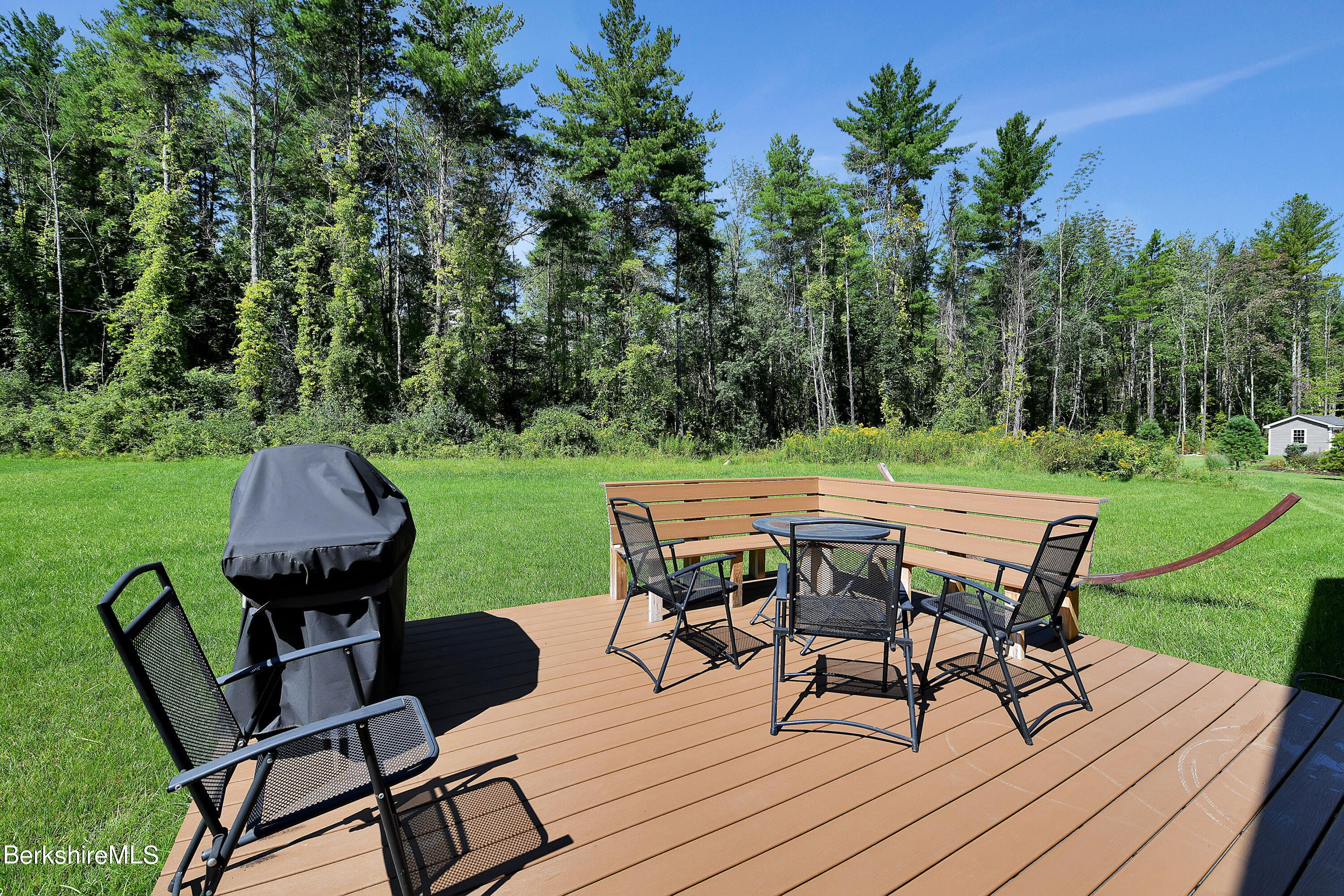 583 W Road Lee, MA 01238 - Photo 24 of 37 a view of a table and chairs on the deck