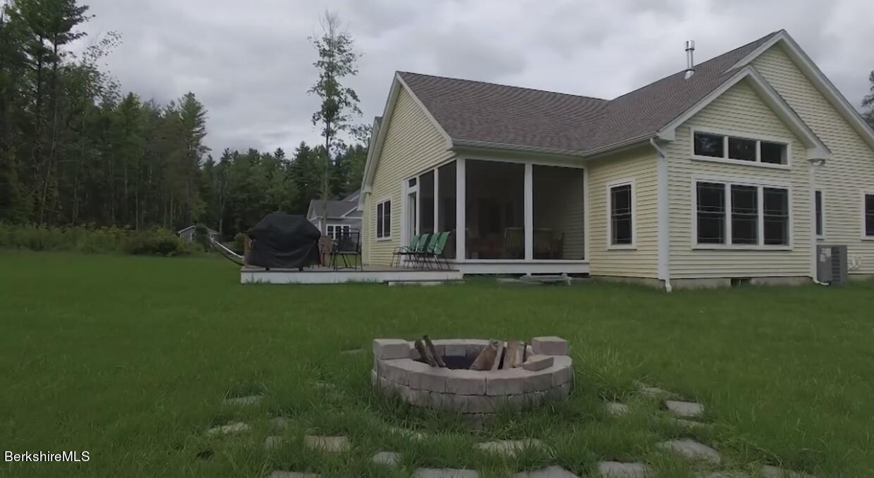 583 W Road Lee, MA 01238 - Photo 32 of 37 a view of a house with a yard