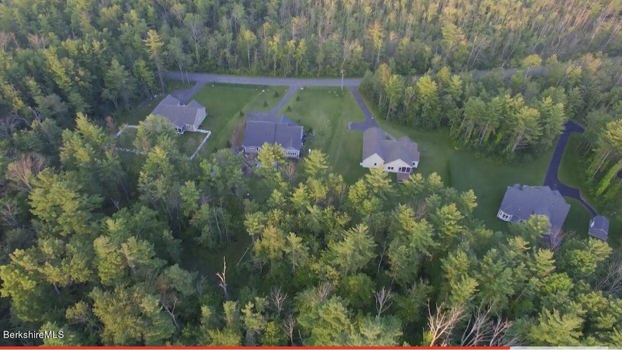 583 W Road Lee, MA 01238 - Photo 34 of 37 an aerial view of residential house with outdoor space and trees all around