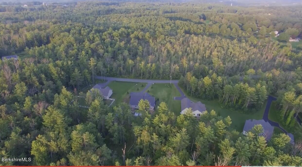 583 W Road Lee, MA 01238 - Photo 35 of 37 a view of a lake with a yard