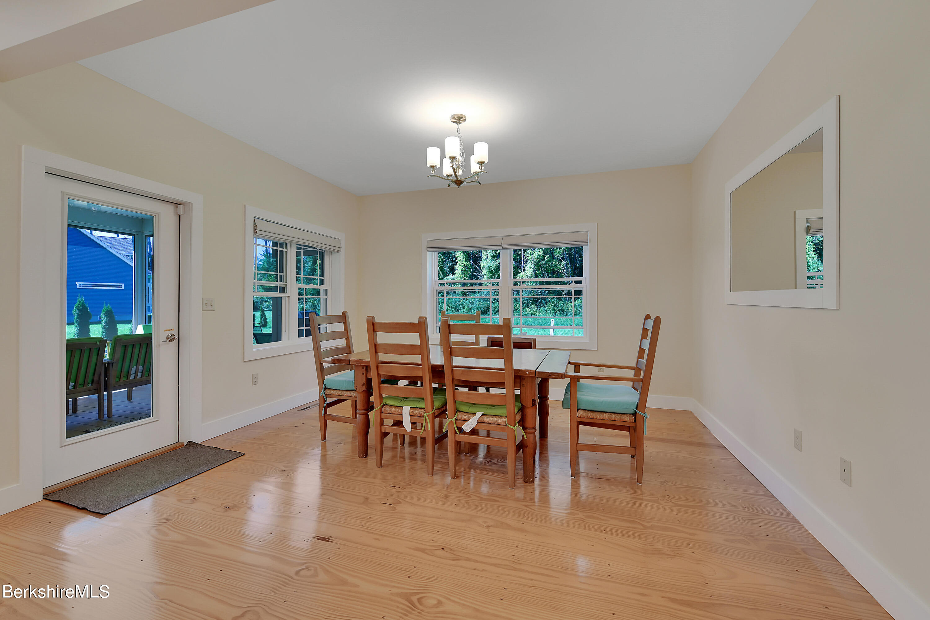 583 W Road Lee, MA 01238 - Photo 8 of 37 a view of a dining room with furniture window and wooden floor