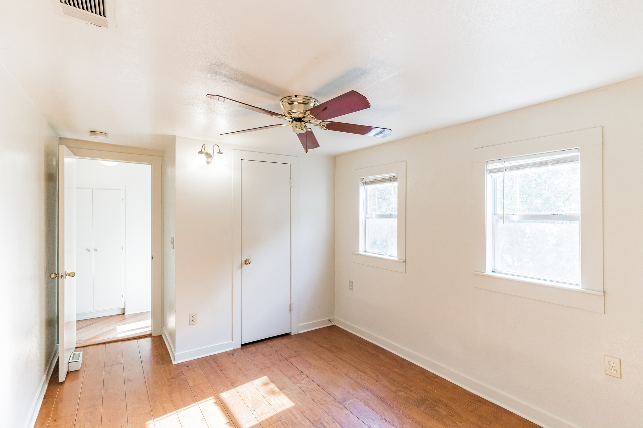 501 East 4th Street Georgetown, TX 78626 - Photo 14 of 25 an empty room with fan and windows
