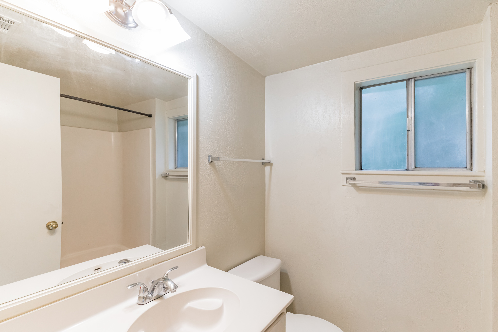 501 East 4th Street Georgetown, TX 78626 - Photo 17 of 25 a bathroom with a sink a toilet and shower