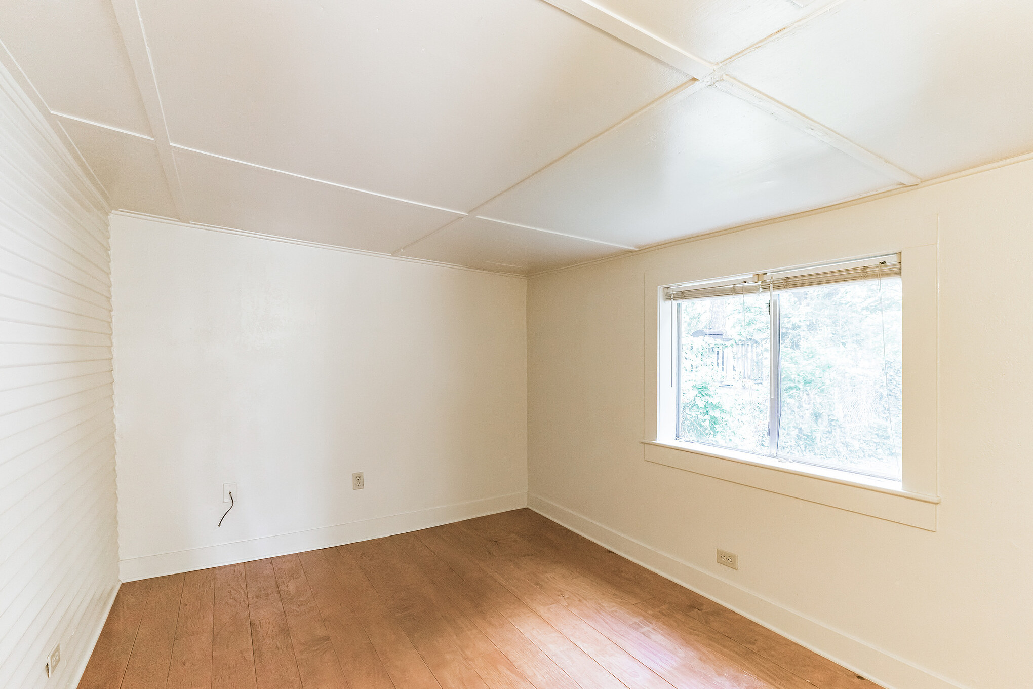 501 East 4th Street Georgetown, TX 78626 - Photo 19 of 25 wooden floor in an empty room with a window