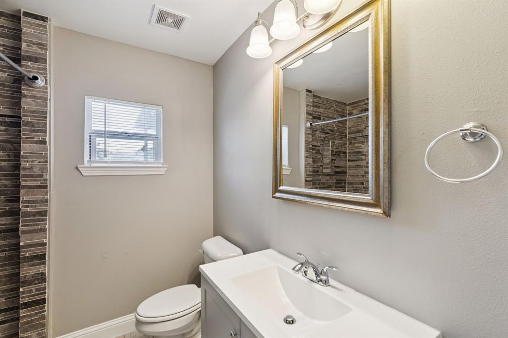 3222 Inwood Road Dallas, TX 75235 - Photo 14 of 25 a bathroom with a sink a toilet and shower
