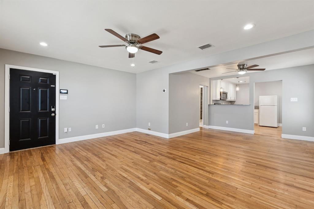 3222 Inwood Road Dallas, TX 75235 - Photo 5 of 25 a view of an empty room and wooden floor