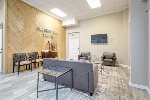 a living room with furniture and a flat screen tv