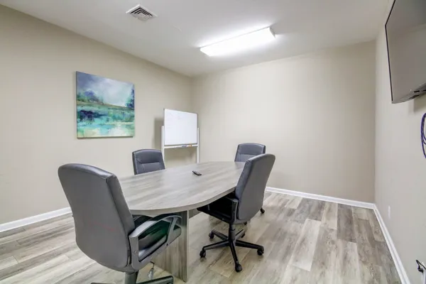 a workspace with furniture and wooden floor