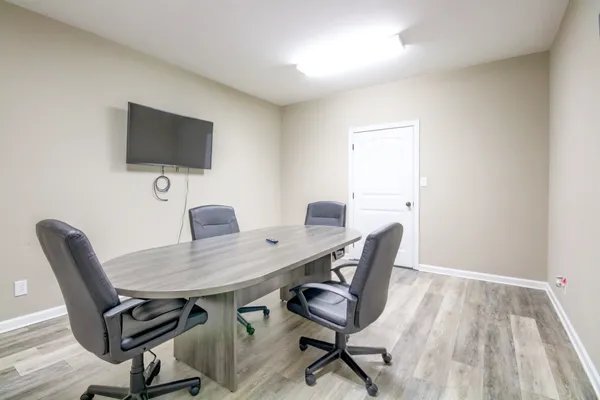 a view of a workspace with furniture