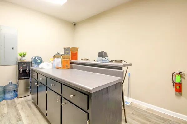 a utility room with sink dryer and washer