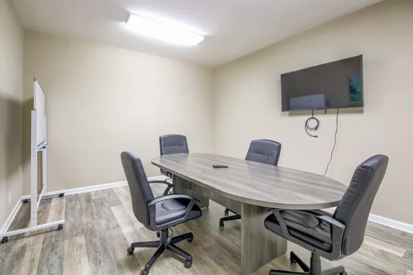 a view of a workspace with furniture