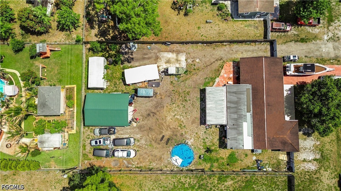 18 Illinois Road Lehigh Acres, FL 33936 - Photo 5 of 45 an aerial view of houses with outdoor space