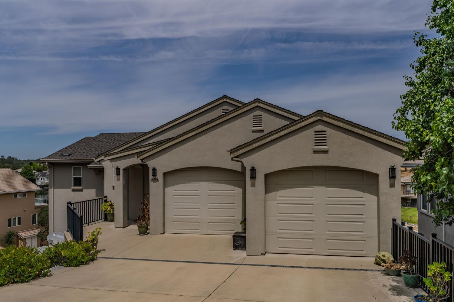 6066 Bluff View Road Copperopolis, CA 95228 - Photo 13 of 96 a front view of a house with a yard and garage