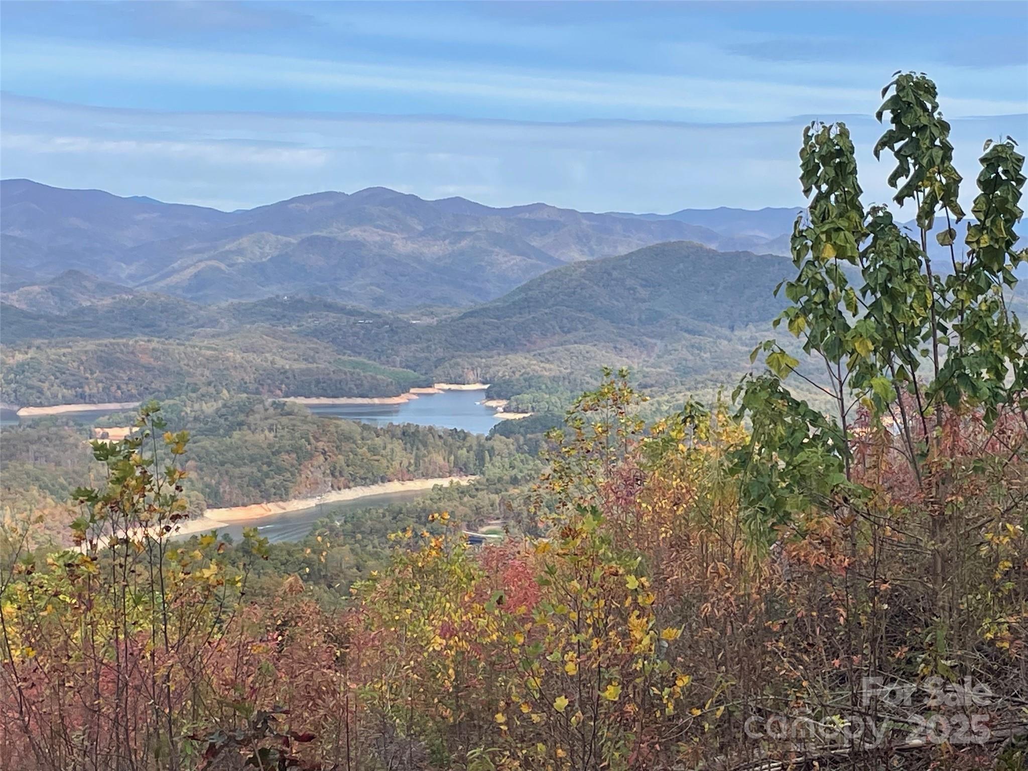 Lot 8 Rocky Ridge Road Bryson City, NC 28713 - Photo 6 of 13 a view of a lake with mountains in the background