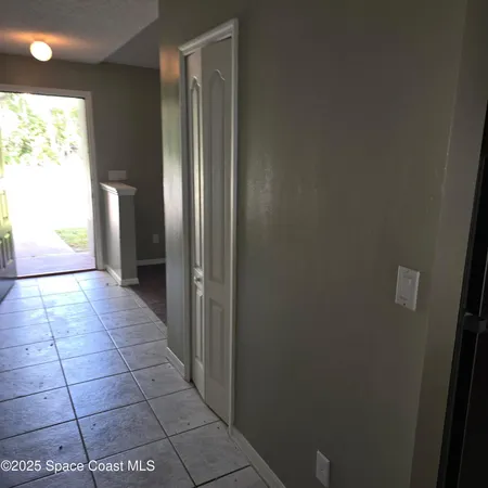 a bathroom with a glass door shower