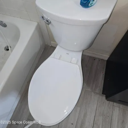 a view of a hallway with washer and dryer