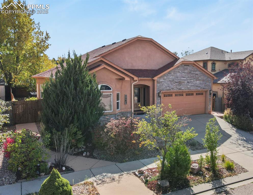 2563 Integrity Court Colorado Springs, CO 80918 - Photo 1 of 49 a front view of a house with garden