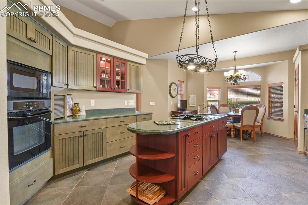 2563 Integrity Court Colorado Springs, CO 80918 - Photo 12 of 49 a kitchen with cabinets a sink and appliances