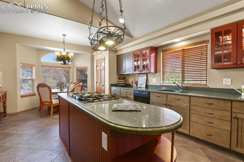 2563 Integrity Court Colorado Springs, CO 80918 - Photo 13 of 49 a kitchen with stainless steel appliances granite countertop a sink a stove and a table