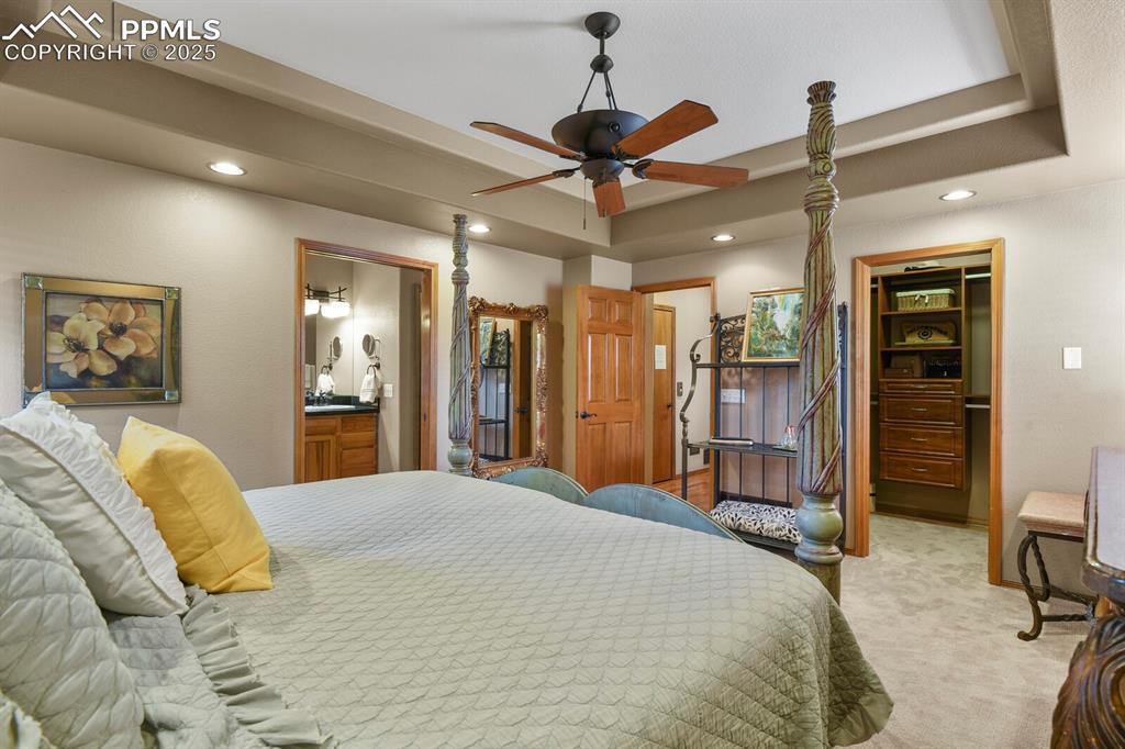 2563 Integrity Court Colorado Springs, CO 80918 - Photo 17 of 49 a bed room with a bed and a walk in closet
