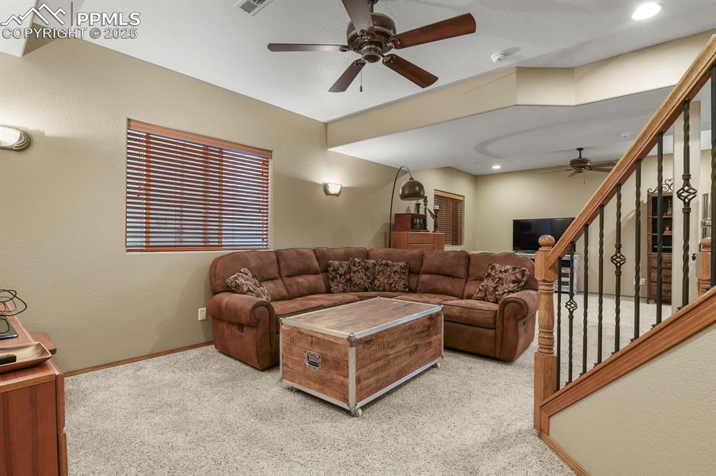 2563 Integrity Court Colorado Springs, CO 80918 - Photo 25 of 49 a living room with furniture and a window