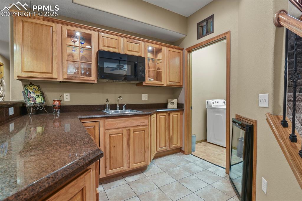 2563 Integrity Court Colorado Springs, CO 80918 - Photo 26 of 49 a kitchen with stainless steel appliances granite countertop a refrigerator and a stove top oven
