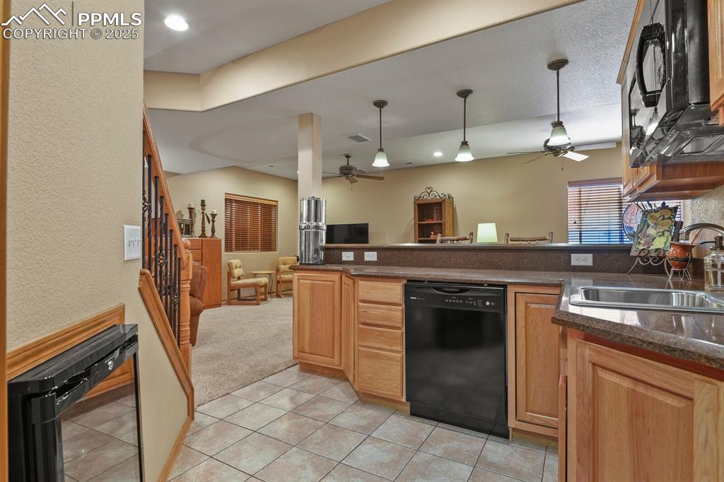 2563 Integrity Court Colorado Springs, CO 80918 - Photo 27 of 49 a kitchen with cabinets and chairs