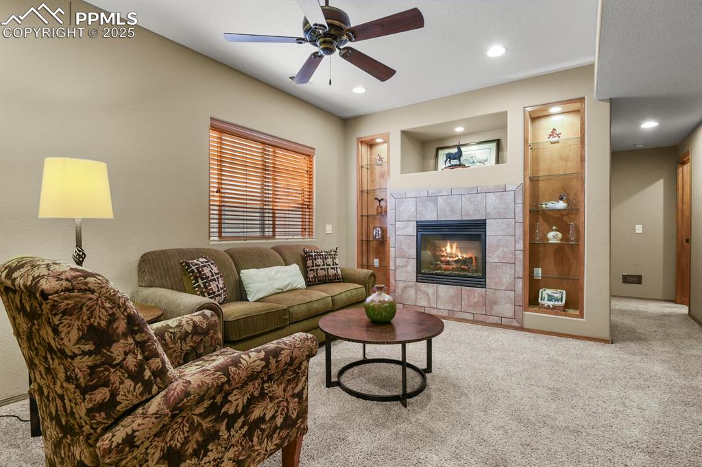 2563 Integrity Court Colorado Springs, CO 80918 - Photo 30 of 49 a living room with furniture and a fireplace