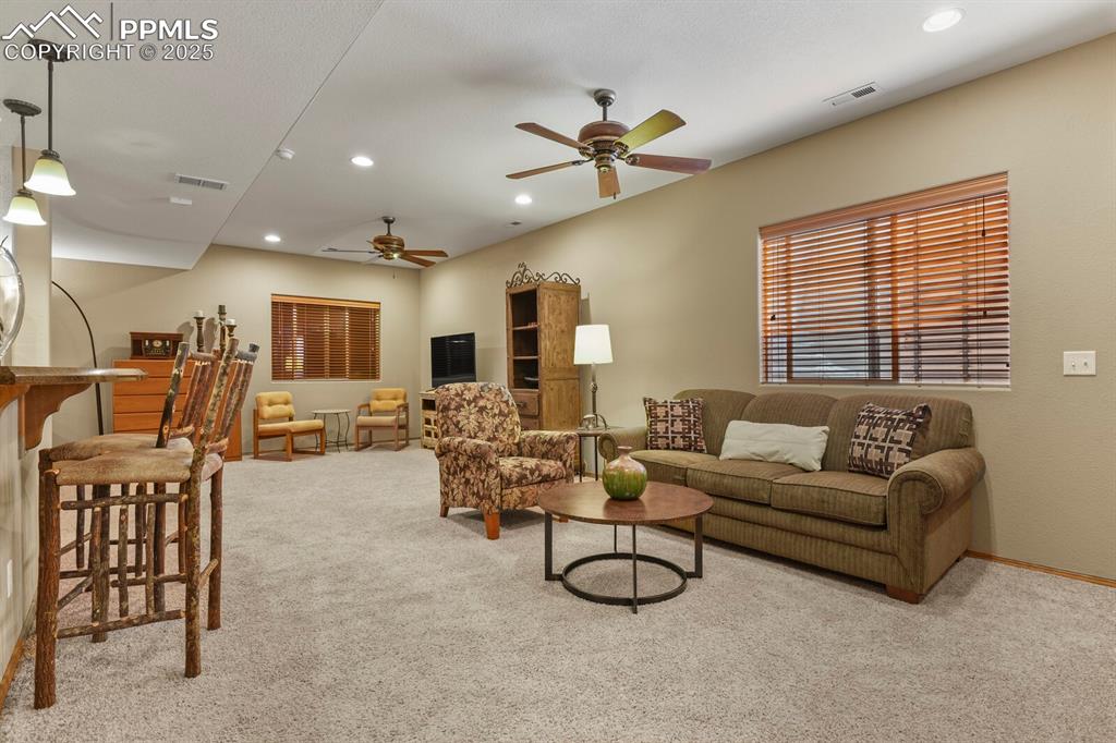 2563 Integrity Court Colorado Springs, CO 80918 - Photo 32 of 49 a living room with furniture and a large window
