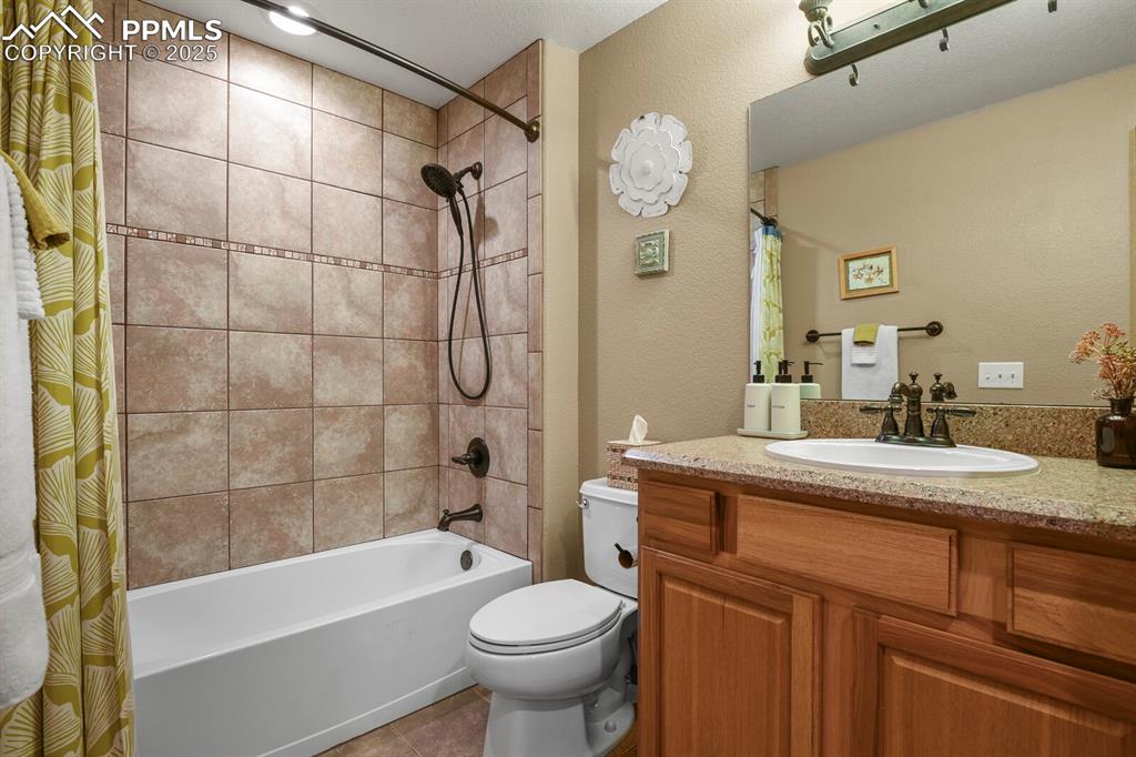 2563 Integrity Court Colorado Springs, CO 80918 - Photo 36 of 49 a bathroom with a sink a toilet and bathtub