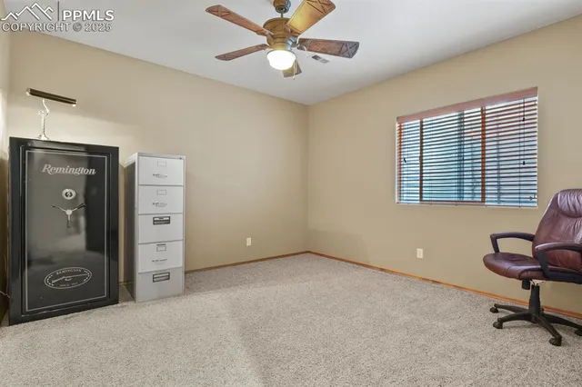 a view of a livingroom with a workspace