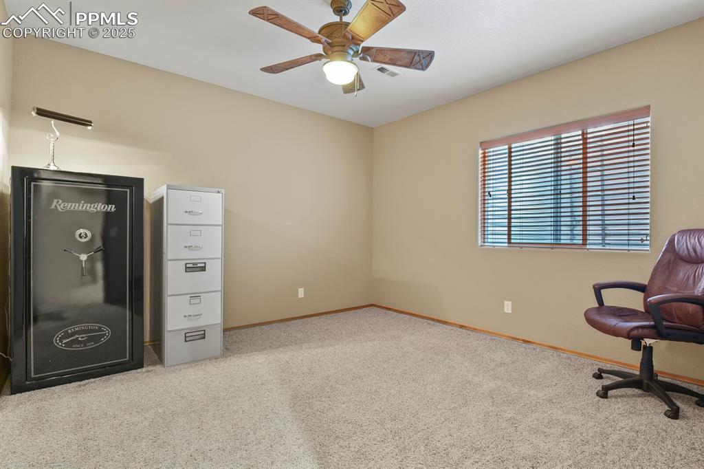 2563 Integrity Court Colorado Springs, CO 80918 - Photo 38 of 49 a view of a livingroom with a workspace