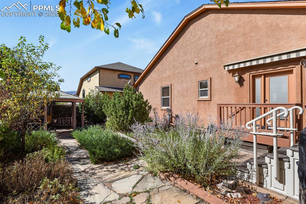 2563 Integrity Court Colorado Springs, CO 80918 - Photo 41 of 49 a view of a house with a small backyard