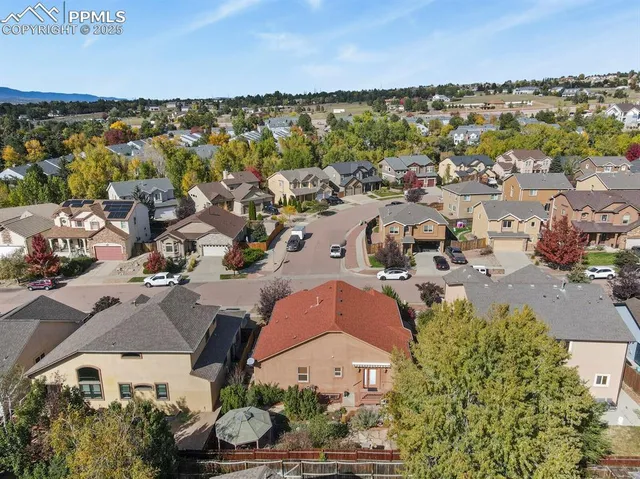 an aerial view of residential houses with outdoor space