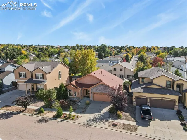 an aerial view of a house with a garden