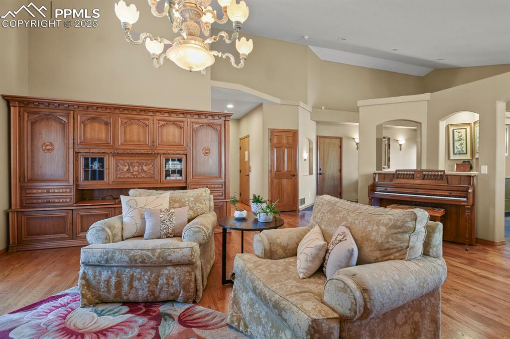 2563 Integrity Court Colorado Springs, CO 80918 - Photo 7 of 49 a living room with furniture or chandelier and a wooden floor
